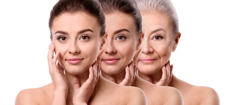 Beautiful young woman with silky skin after spa treatment on whi